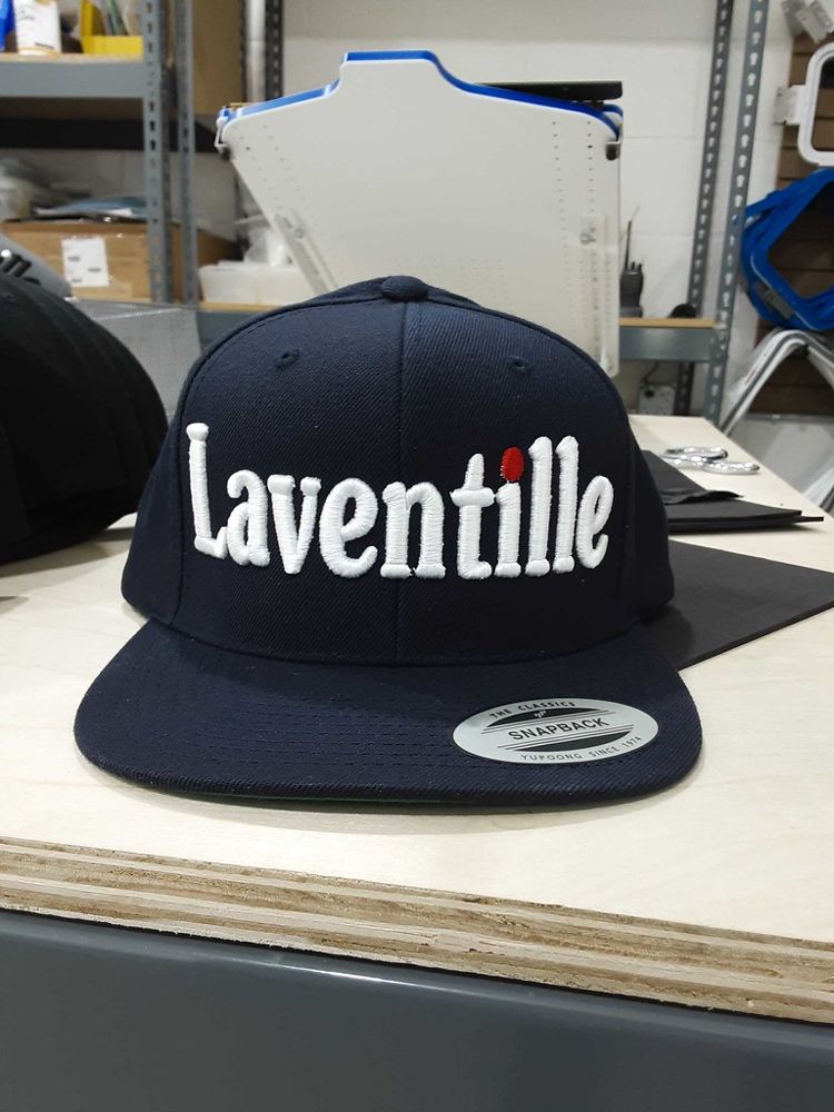 Navy snapback with white embroidered Laventille lettering