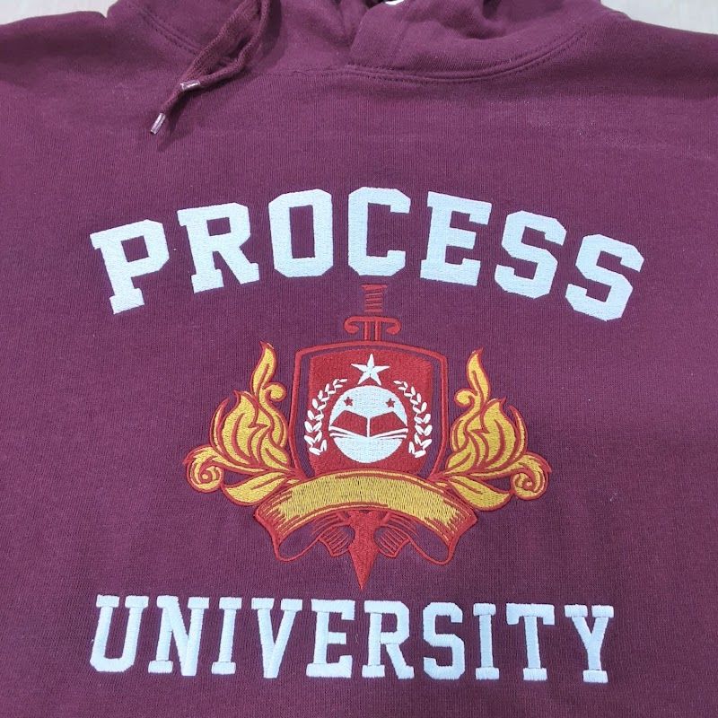 Maroon hoodie with a printed university crest